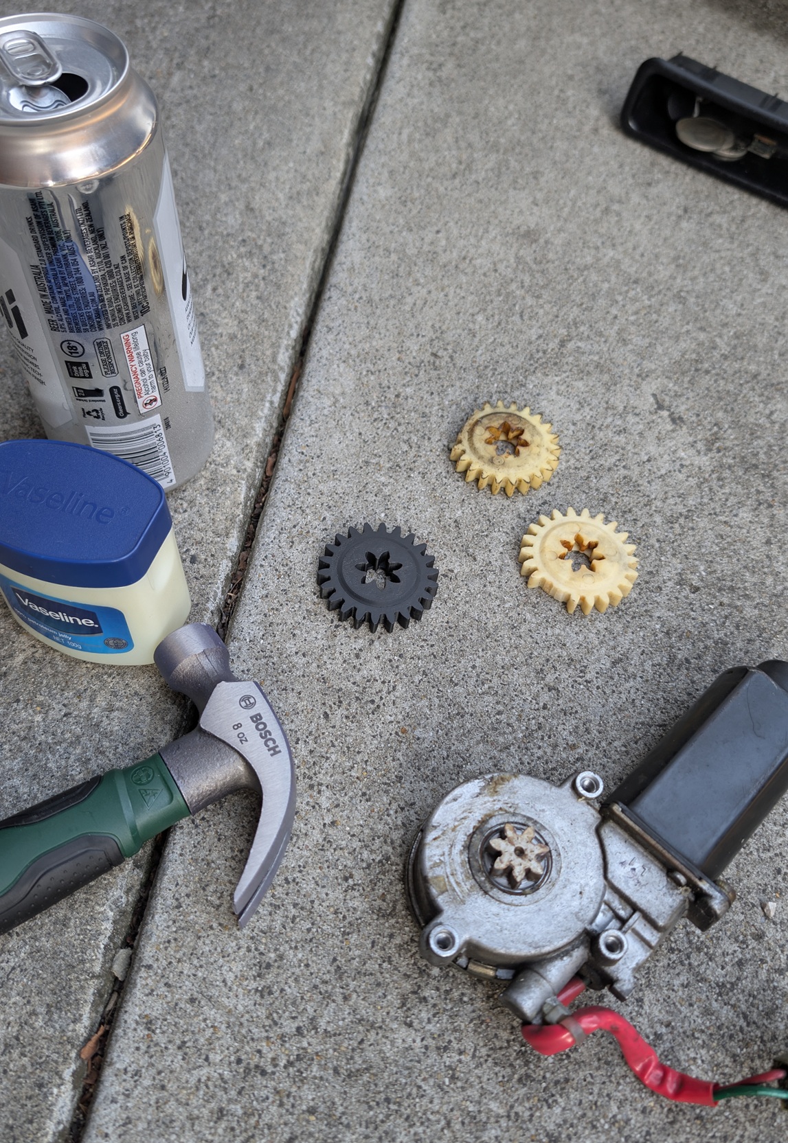 Hammer, vaseline, power window motor, gears and beer